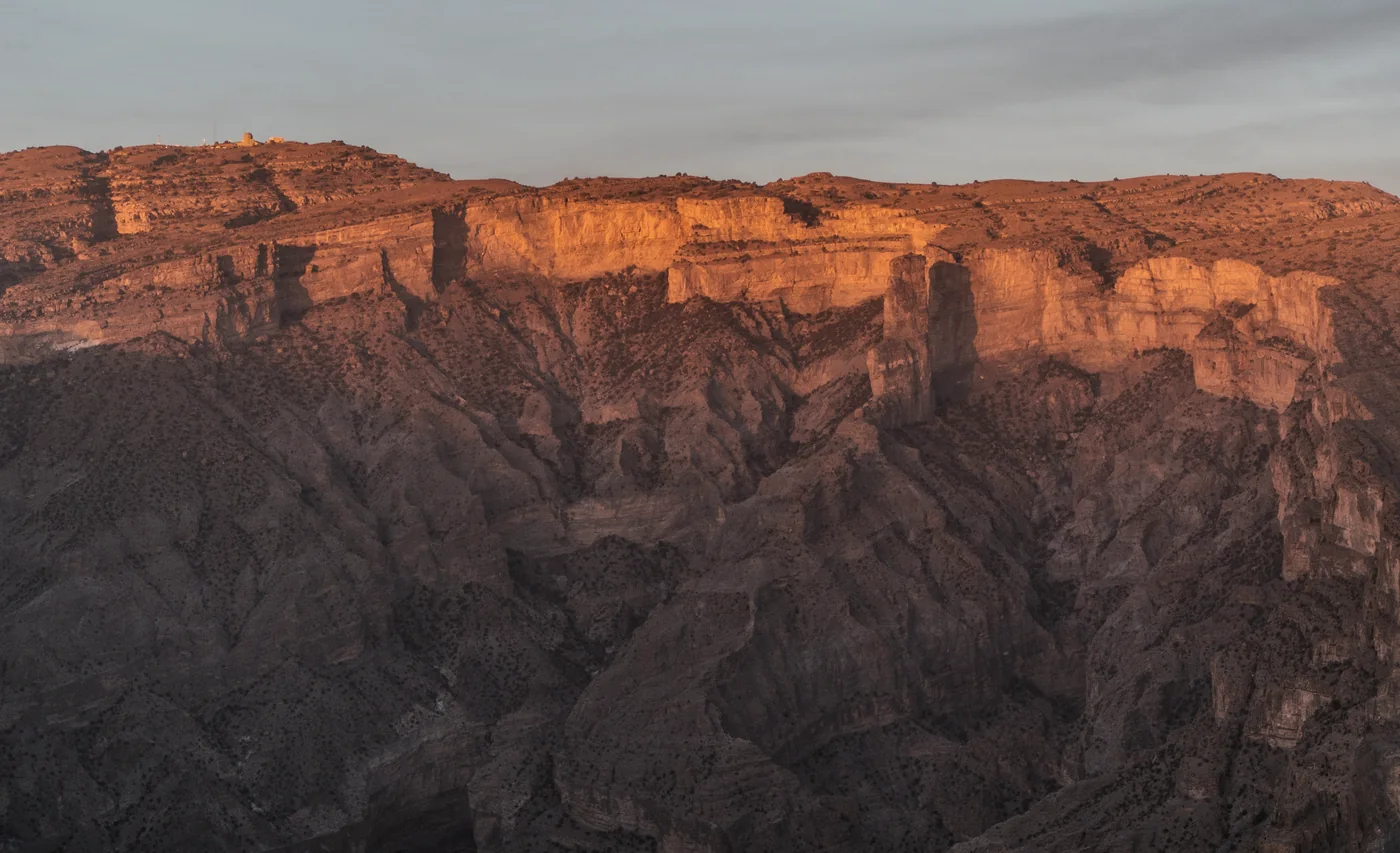 The cliffs of Jebel Shams in the Hajar Mountains, Oman, at sunset